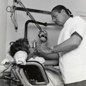 A Cuban refugee dentist examines a patient at the medical dispensary of the Cuban Refugee Center