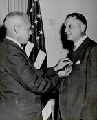 Juan Trippe receiving Medal of Merit from Secretary of War, Robert P. Patterson